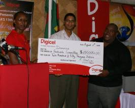 digicel_presents_cheque_13wcmf_launch.jpg