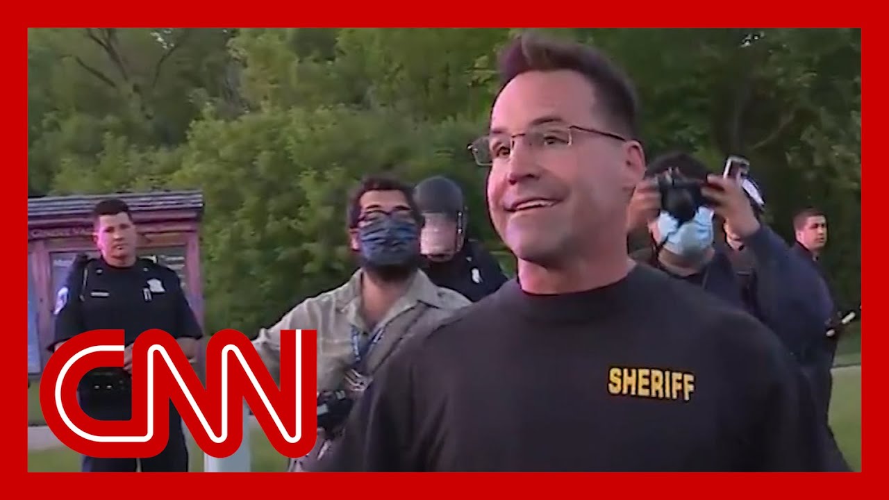 Sheriff takes off riot gear and joins peaceful protesters 1