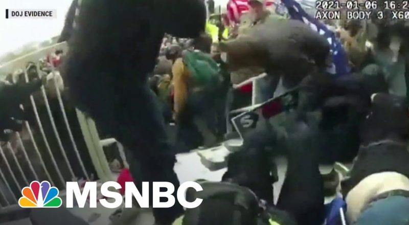 FBI Releases New Video Of Officers Dragged Into Crowd During Capitol Riot 1