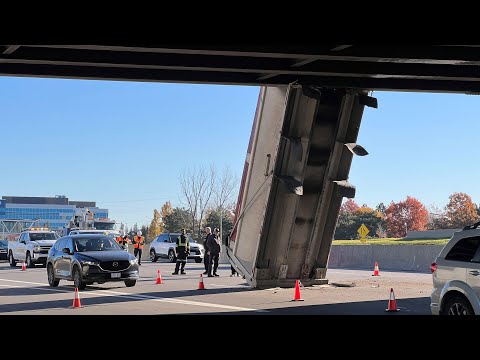 Dump truck gets wedged under overpass on Ottawa highway 5