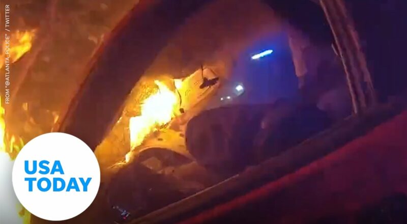 Two Atlanta police officers rescue man from burning car | USA TODAY 2