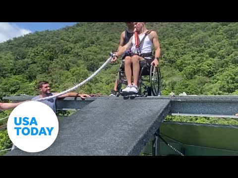 Man in wheelchair attached to bungee plunges nearly 165 feet off roof | USA TODAY 1