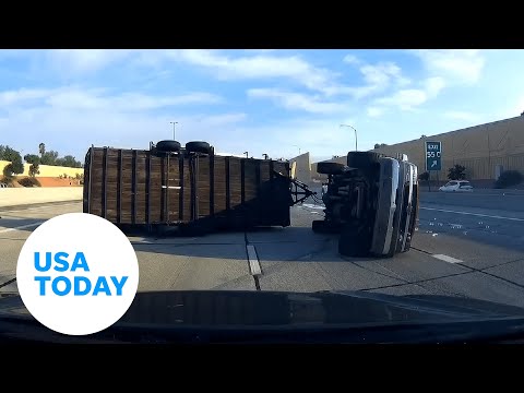 Truck fails to stop in time, flips with trailer on Arizona freeway | USA TODAY 1