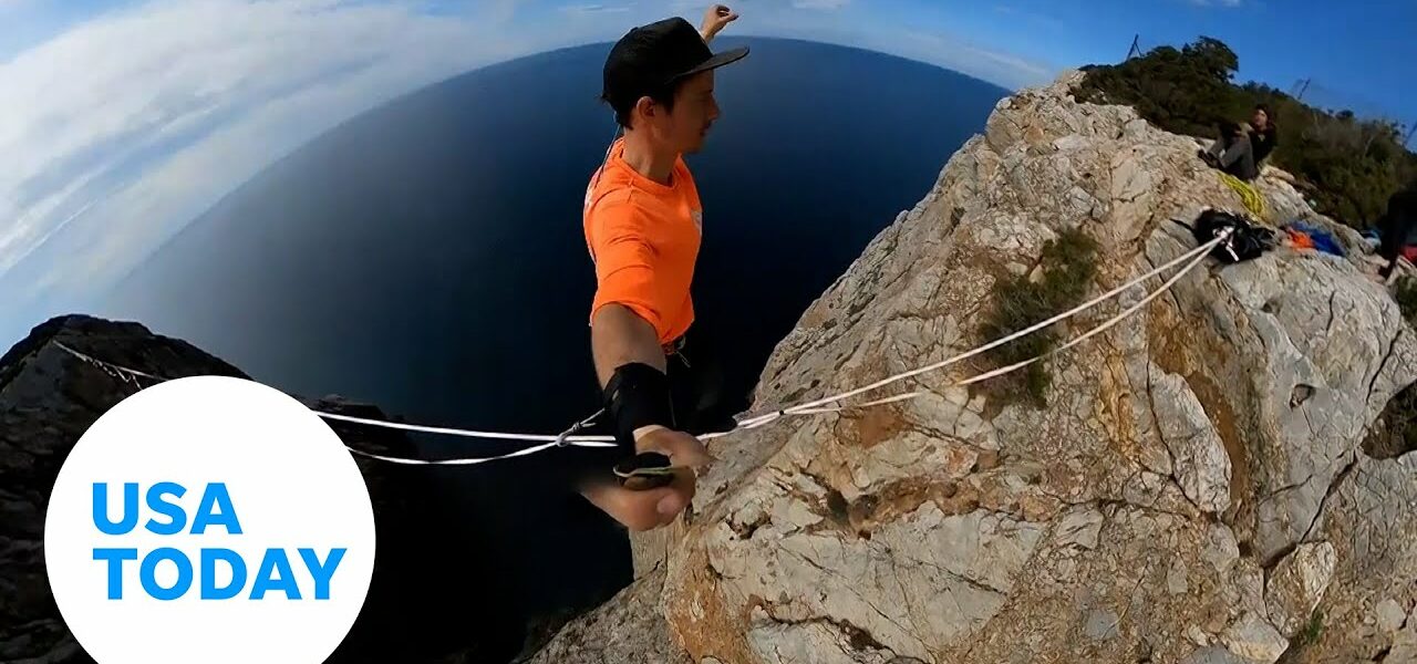 Daredevil risks dangerous heights on tightrope into girlfriend’s arms | USA TODAY 1