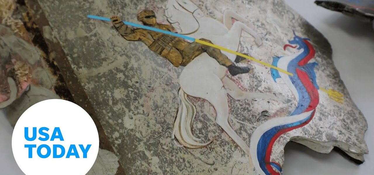 Ukrainian artists paint on Russian missile fragments to raise funds | USA TODAY 3