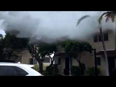 Watch: Massive waves crash over two-story homes in Hawaii 1