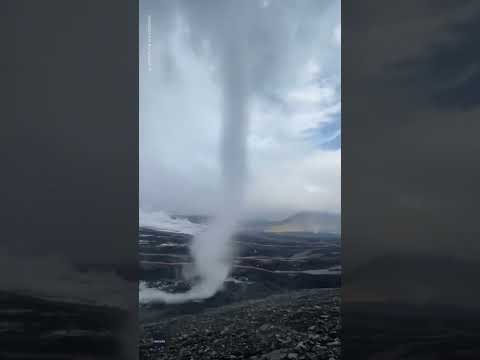 Adventure photographer captures funnel cloud tornado on Iceland volcano | USA TODAY #Shorts 2